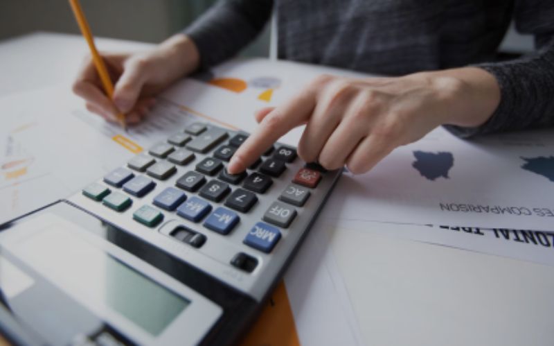 Business owner reviewing cash flow under pressure from unpaid ATO tax debt.